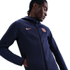 FELPA CON CAPPUCCIO FULL-ZIP NIKE BARCELONA TECH FLEECE ANTIVENTO 3RD